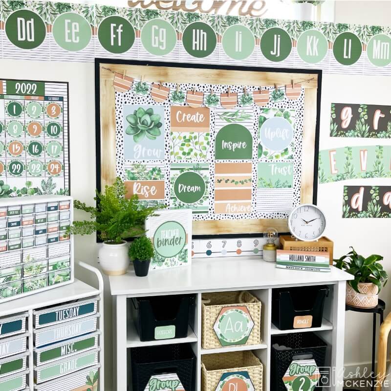 A modern greenery themed classroom features delicate greenery images and a calming color palette.