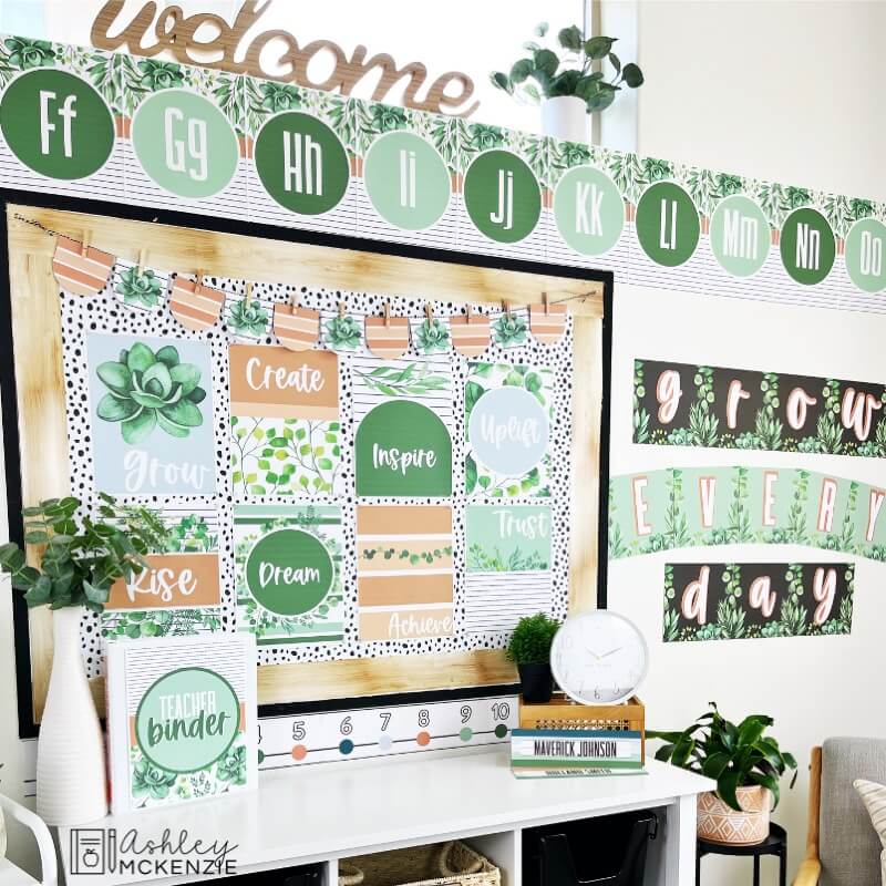 Classroom decor that features positive sayings and affirming messages. Beautifully designed classroom posters decorate a bulletin board and a wall display is created from decorative word posters with the saying "grow everyday."