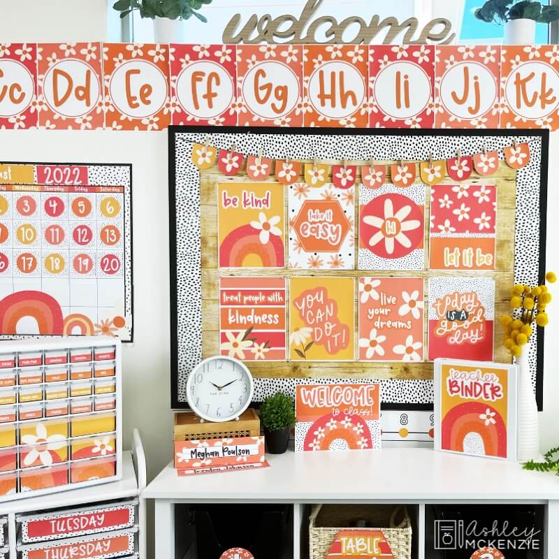 A classroom completely decorated with daisy themed decor, including bright classroom posters, an oversized wall calendar, alphabet posters, and more.
