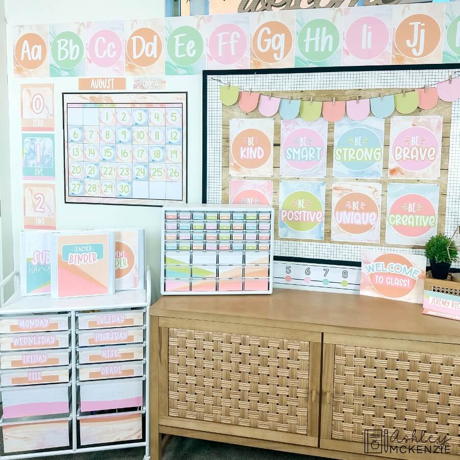 A classroom decorated with pastel banners, posters, and organizing tools