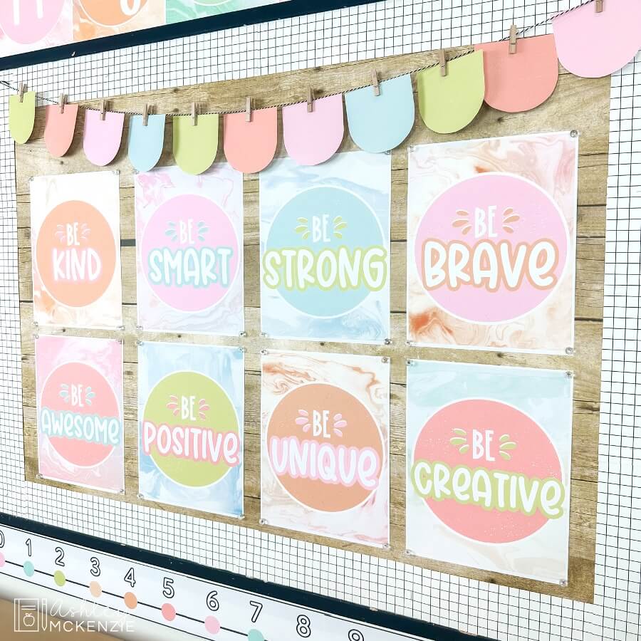 Classroom posters with inspirational sayings like "Be Kind" and "Be Brave" are displayed on a bulletin board