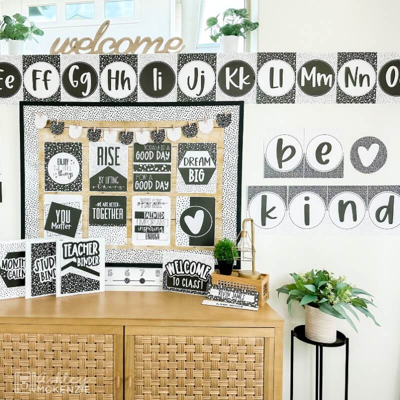 A classroom decorated with black and white terrazzo classroom decor including a "Be Kind" word poster decoration