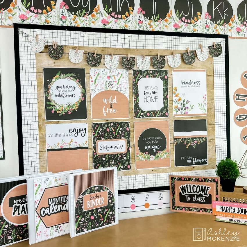 Classroom posters featuring colorful wildflowers and inspirational sayings decorate a bulletin board
