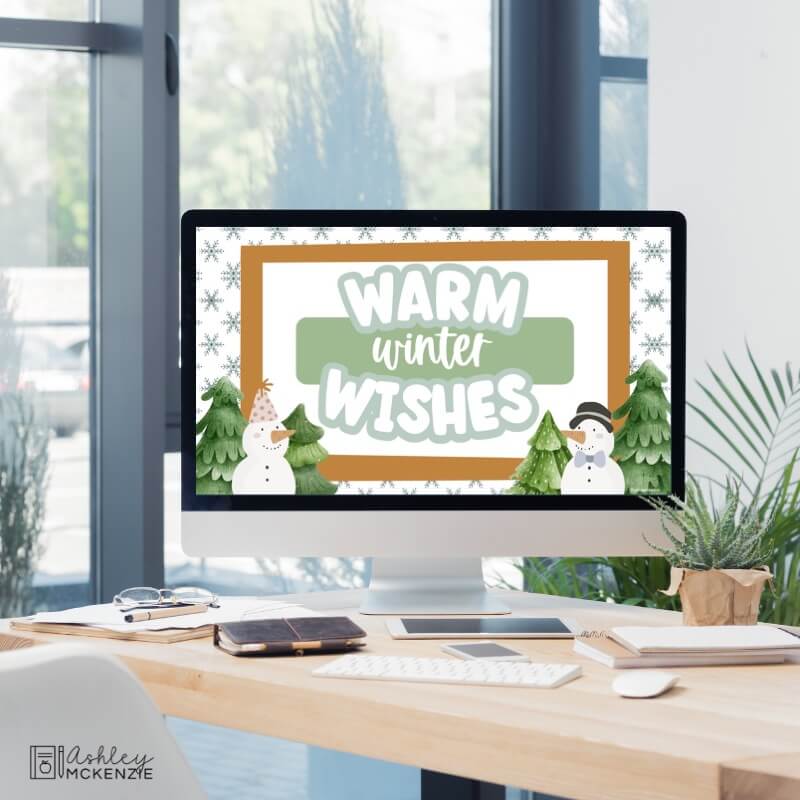 A classroom computer displaying a winter themed Google Slides Template with the greeting "Warm winter wishes"