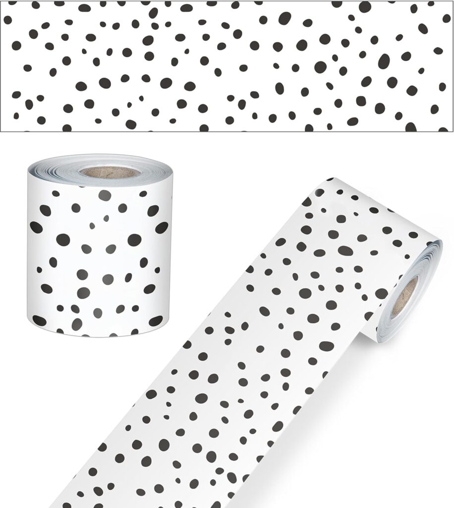 A bulletin board border with small black polka dots on a white background