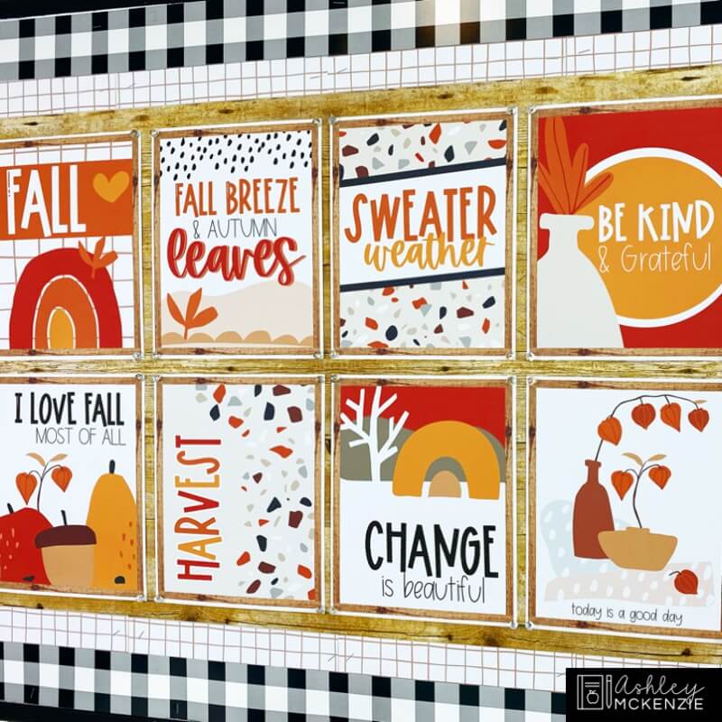 A classroom bulletin board decorated with boho fall themed classroom posters