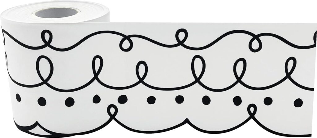 A bulletin board border with a black and white squiggles and dots pattern