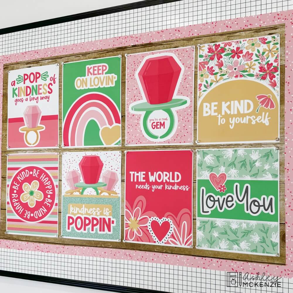 A classroom bulletin board decorated with Valentine's Day themed posters