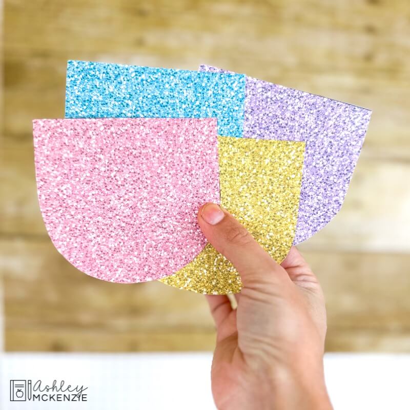 Bulletin board banners are shown in 4 pastel colors with a glittery texture