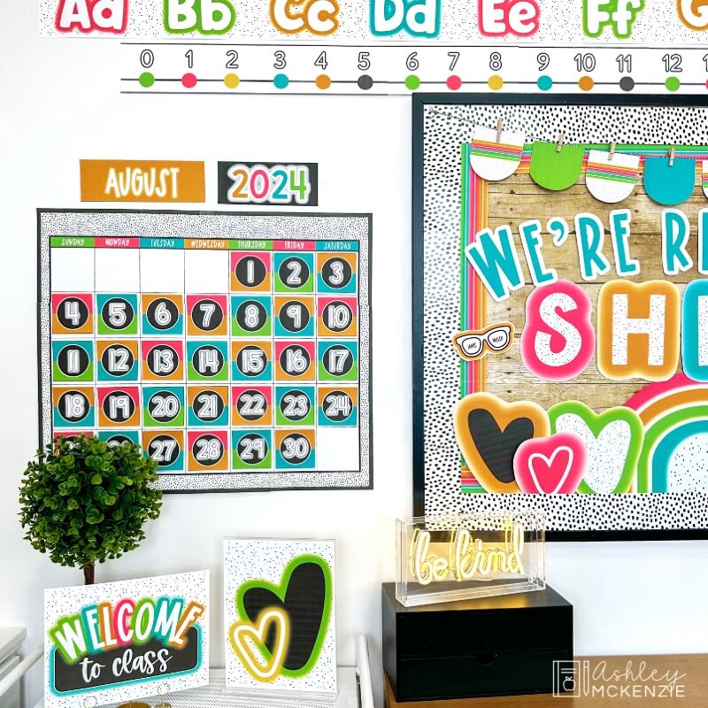 A classroom calendar featuring bright, neon colors