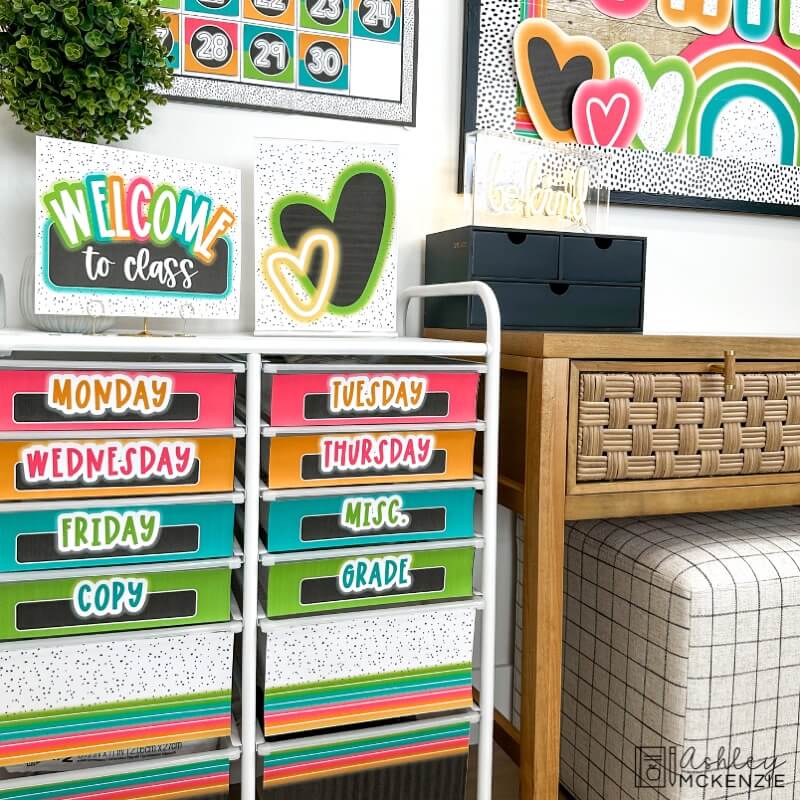 A 12 drawer rolling cart for teacher organization featuring neon brights rolling cart labels