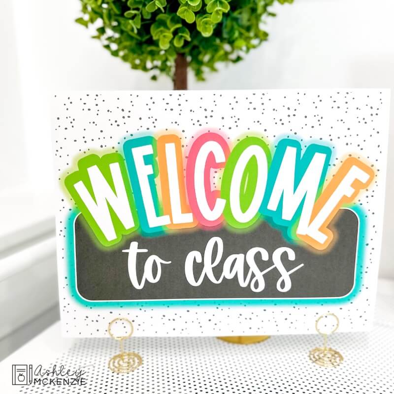A free classroom sign that says "Welcome to Class" in a neon brights theme